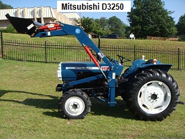Mitsubishi D3250fd utility tractor parked on a lawn outside