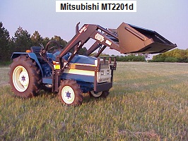 Mitsubishi MT2201d tractor parked outside in a field